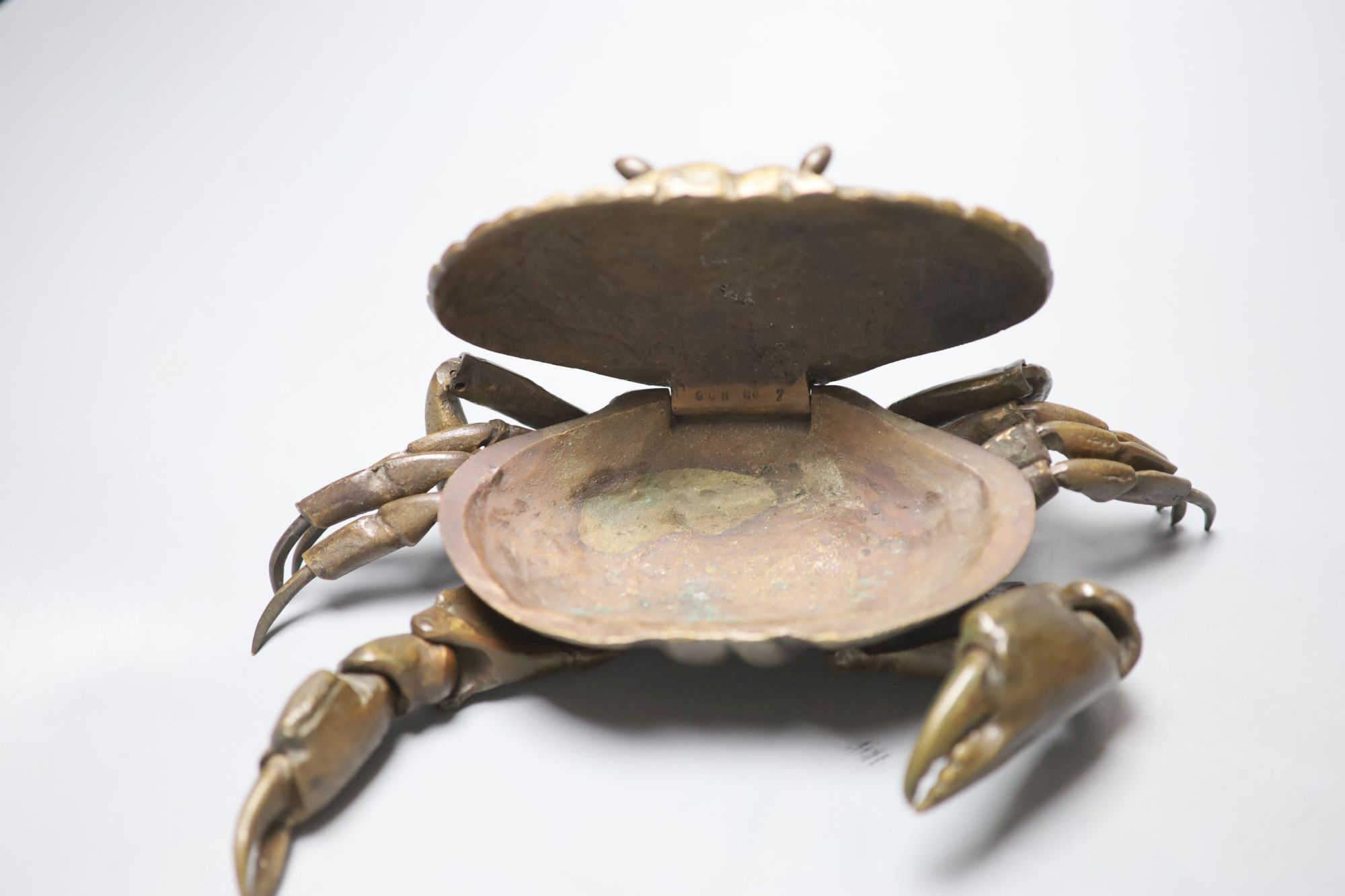 A mid 20th century bronze articulated model of a crab, with hinged carapace, 26cm across